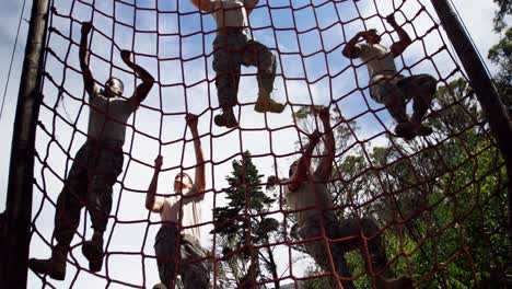 Military-troops-climbing-a-net-during-obstacle-course-4k