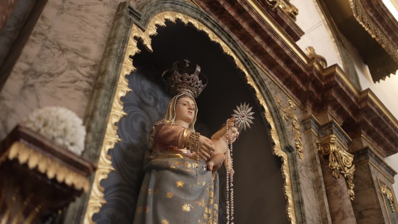 Statue of the Virgin Mary and Child Jesus in a Church