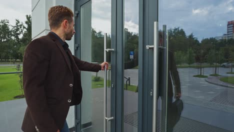 businessman leaving office building