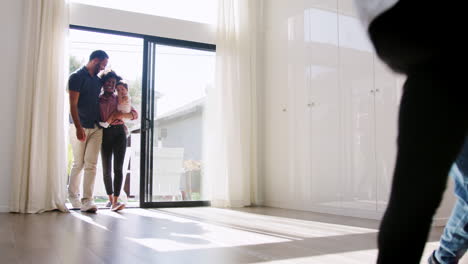 excited family exploring new home on moving day