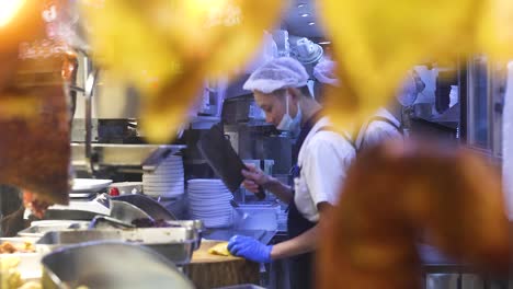 chef skillfully prepares roast duck in kitchen