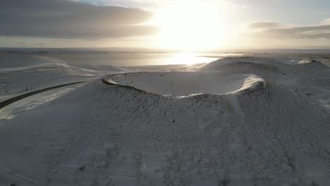 a giant snowy crater in the north of iceland during the winter, aerial