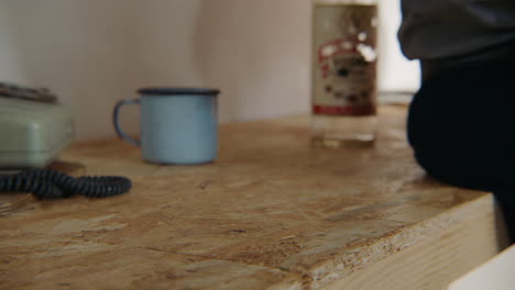 person sitting at a cluttered desk