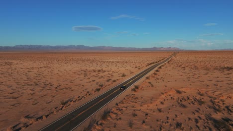 car driving in the desert on a road from california to arizona