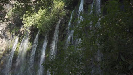 SLOW-MOTION-SHOT-OF-TZARARACUA-WATERFALL-IN-URUAPAN-MICHOACAN-AT-MID-DAY