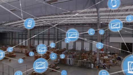 animation of network of digital icons against aerial view of warehouse