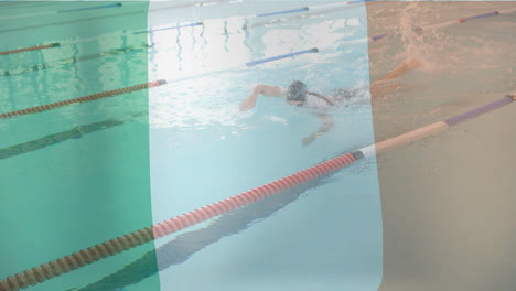 animation of flag of ireland over caucasian female swimmer