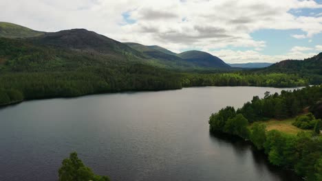 aerial majesty: loch an eilein's reflective waters and pine forest in aviemore, cairngorms – a scottish highlands treasure, united kingdom