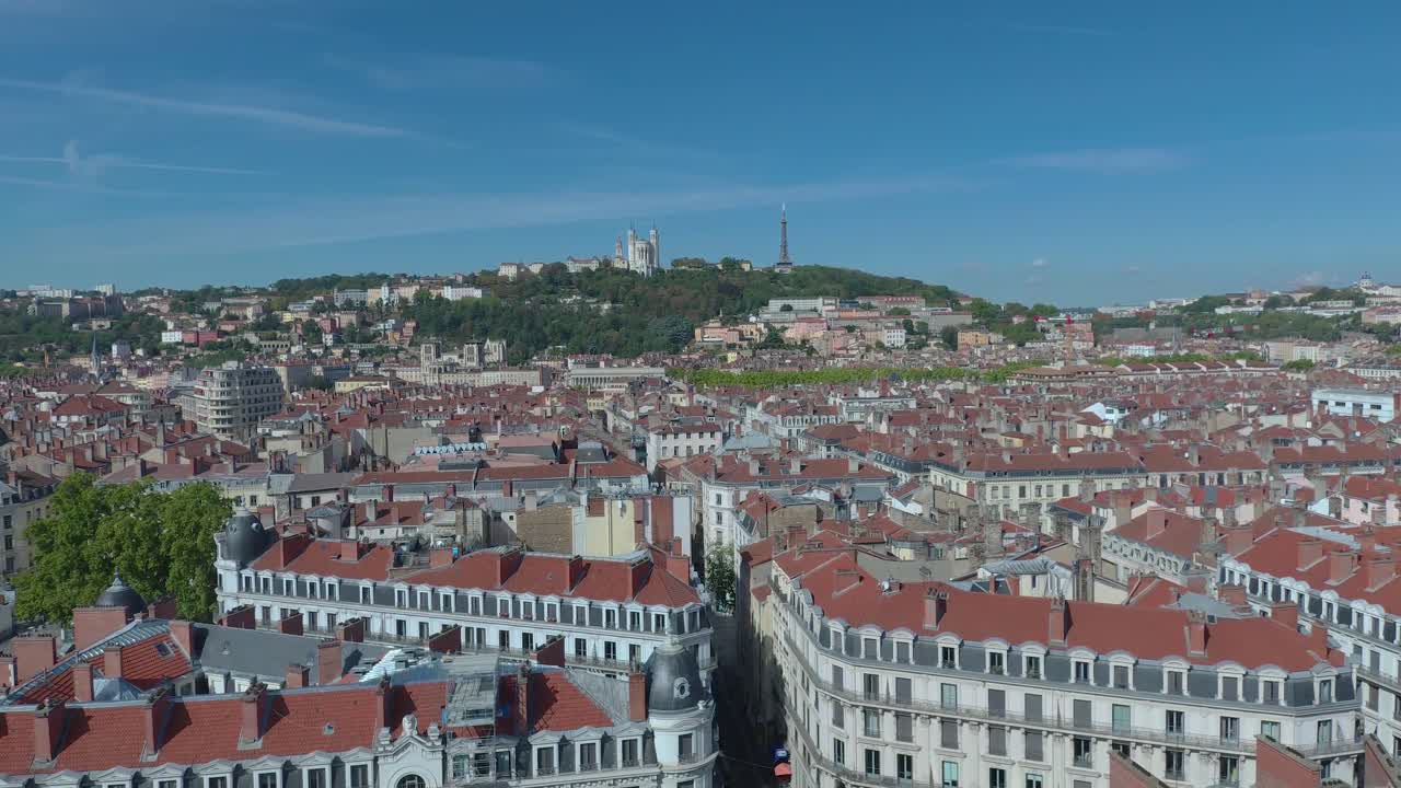 Aerial drone view over Lyon city center – River, bridge, and buildings below