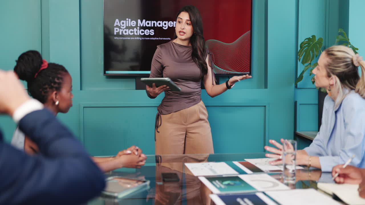 Woman Presenting Agile Management Practices to Colleagues in a Meeting