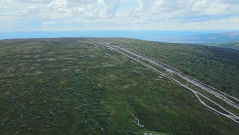 aerial view of green fields and meadows in högfjällshotellet, sälen, dalarna, sweden - drone shot