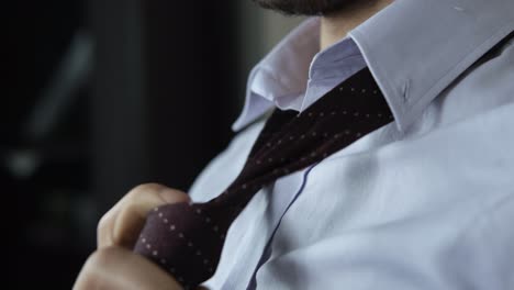 man relaxing tie