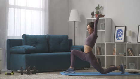 yoga practice at home young woman is performing asana training in living room stretching legs and hands muscles healthy lifestyle