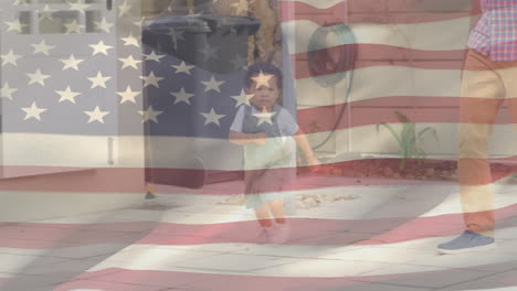 biracial child running with us flag waving foreground