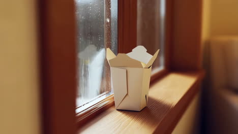takeout box on window sill