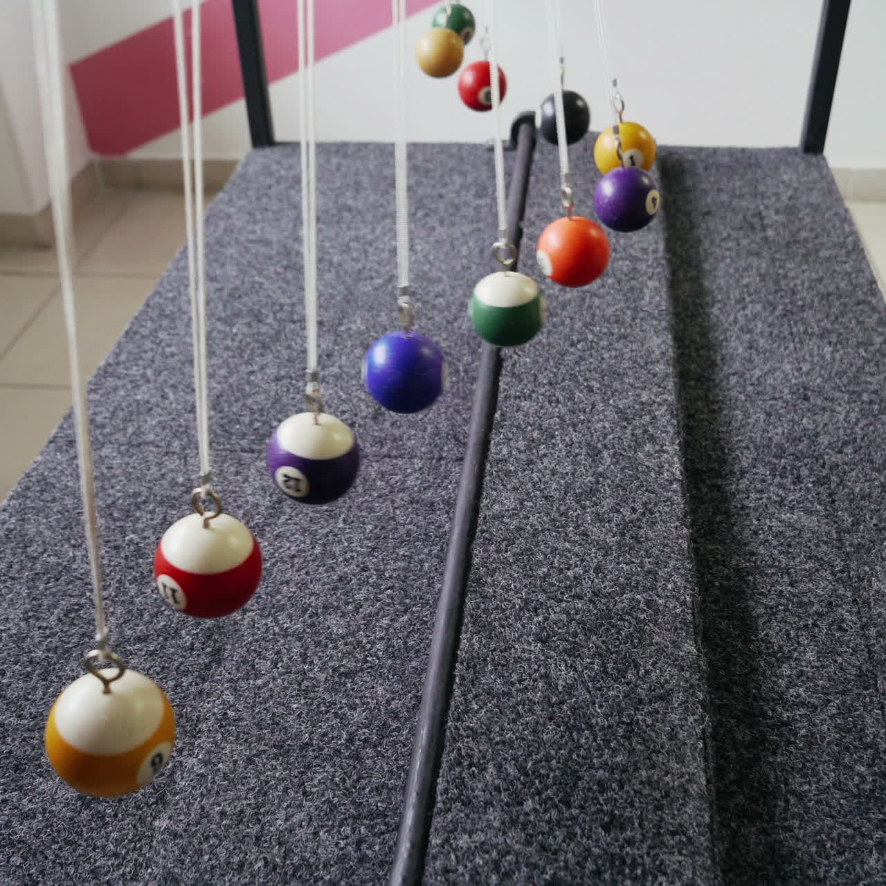 Balancing balls of Newton's cradle. Museum of Science
