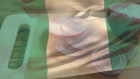 nigerian flag animation overlay on cutting board with sliced red onions