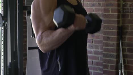 muscly man in home gym exercising strict bicep curl