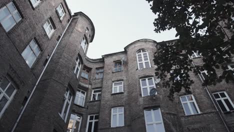 view from the courtyard of the brick apartment building