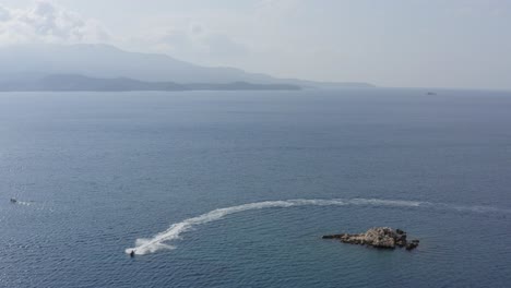 Extreme-Jet-Ski-in-on-Meditteranean-Ocean-in-Saranda-Albania,-Drone