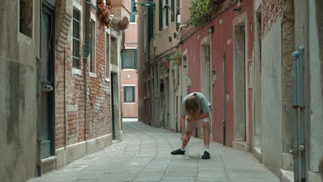 teenager bottle flip challenge on venetian street