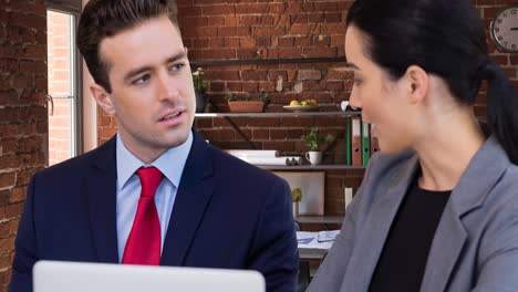 Animation-of-caucasian-business-people-using-laptop-at-meeting-in-office