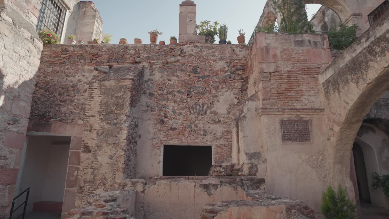 Exterior of an old building with brick and stone walls