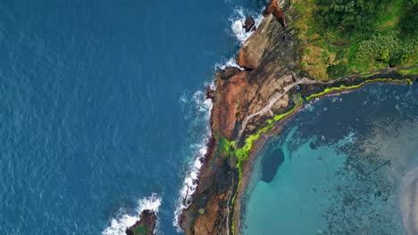 aerial coastal landscape rocky shore. picturesque wild cliffs on summer day.