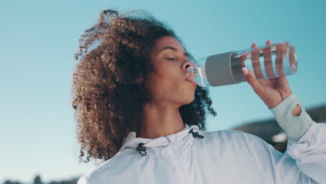 Beach,-sports-and-woman-drinking-water