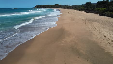 Ocean-Waves-And-Sandy-Shore-Of-Sapphire-Beach-In-New-South-Wales,-Australia---drone-shot