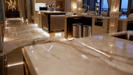 luxurious modern kitchen with marble and gold accents