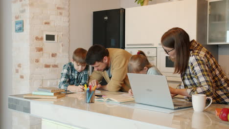 family doing homework together in the kitchen