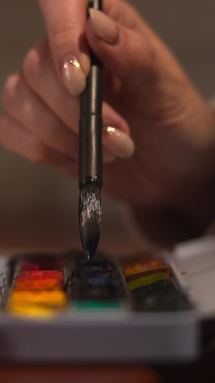 Hand Selecting Watercolor Tones From Palette, Brush Tapping Vibrant Pans For Accent Colors, Closeup Of Hand. Media