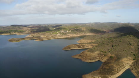 Drone-flight-over-a-huge-drainage-basin-in-a-mountain-region