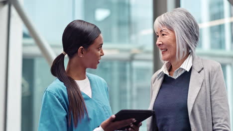 talking, senior woman and doctor with a tablet