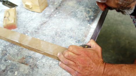 Focus-on-carpenter-working-with-wood