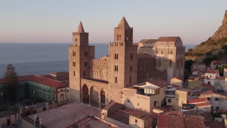 Aerial-view-of-Cefalu-medieval-city-during-summer-at-sunset,-Sicily,-Italy