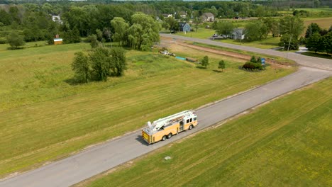 orbiting aerial view of a yellow firetruck waiting for its next service call