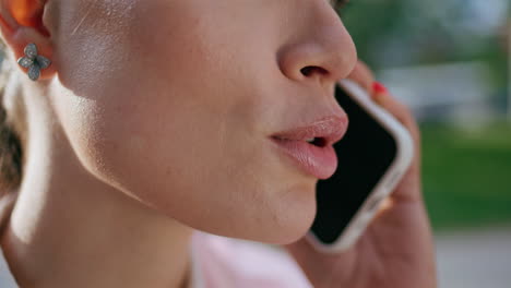 closeup face woman calling smartphone on street. businesswoman talking phone