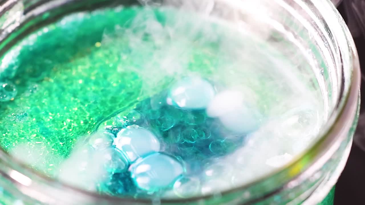 Bubbling reaction in a jar with smoke