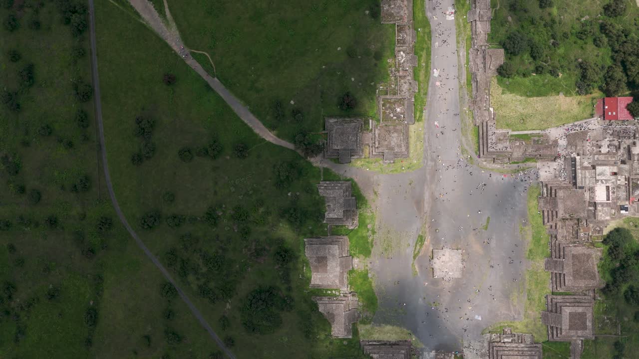 Aerial bird's-eye shot showing light and shadow playing over Teotihuacan, Mexico