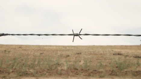 a boarder fence with barbwire