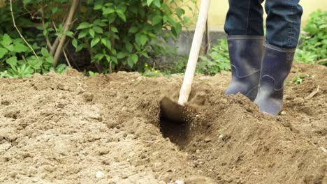 Man-Manually-Plows-The-Farming-Łand-Using-A-Wooden-Plough