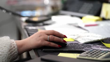 close-up-of-corporate-business-lady-with-expensive-ring-mouse-scrolling-in-a-office-enviroment