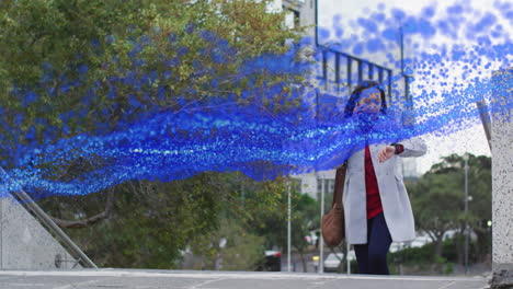 woman ascending urban steps, checking smartwatch and holding smartphone amid technology data stream