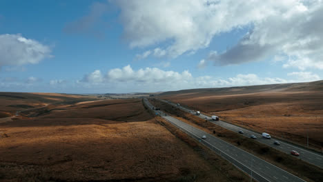 cinematic aerial footage view of m62 motorway, saddleworth, windy hill, uk