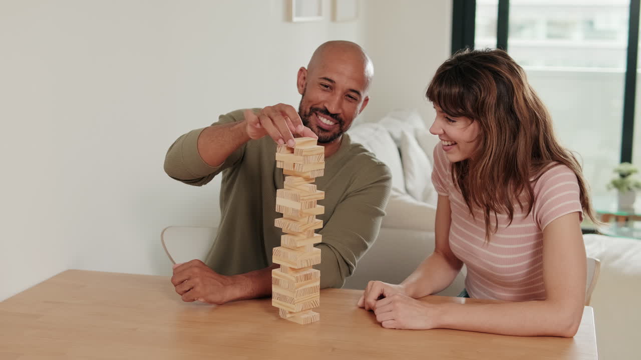 Happy Couple Plays Jenga at Home