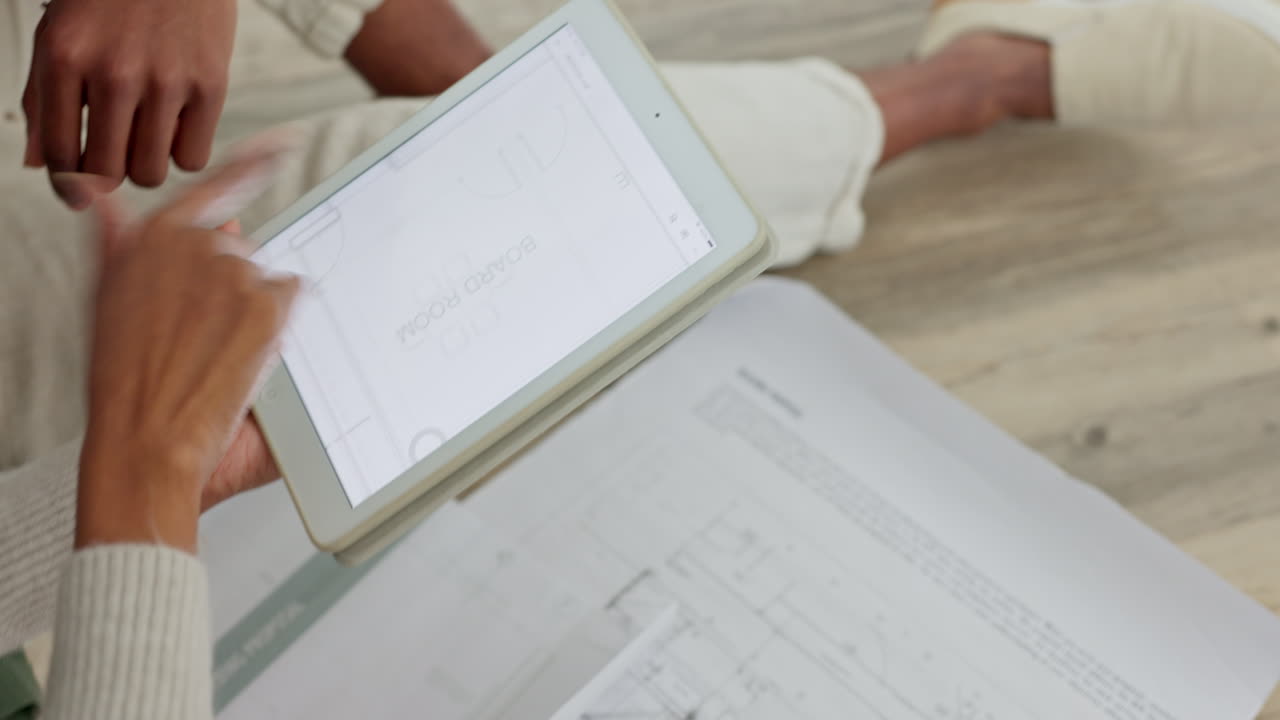 Couple, tablet and blueprint renovation