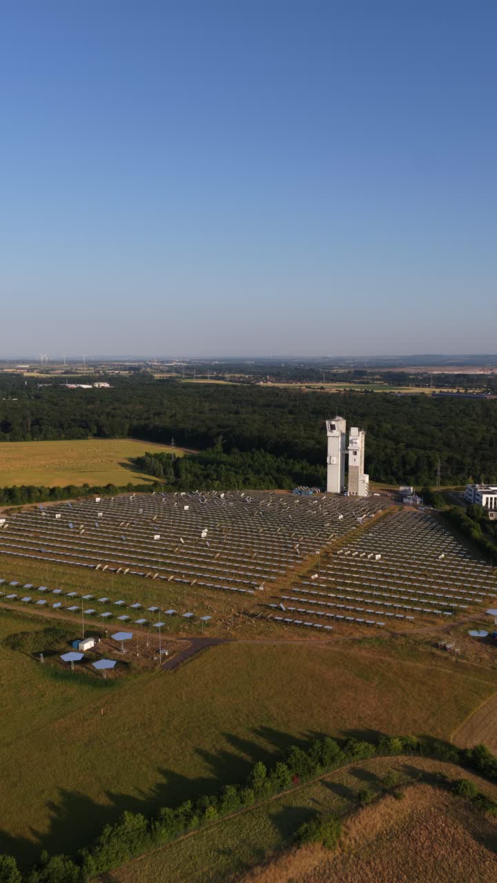 solar energy using mirrors to heat water for steam generation in Jülich, Germany, solar thermal technology, renewable energy, aerial vertical video