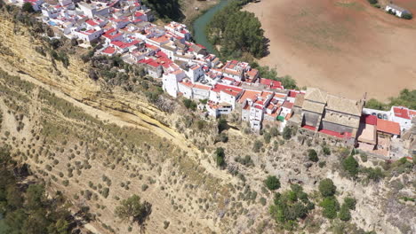 AERIAL---Arcos-de-la-Frontera-in-Cadiz,-Andalusia,-Spain,-wide-shot-tilt-up